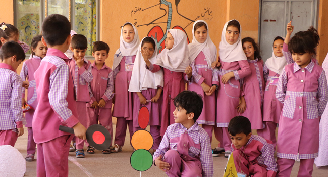 Afghan schoolchildren engaged in a classroom activity.