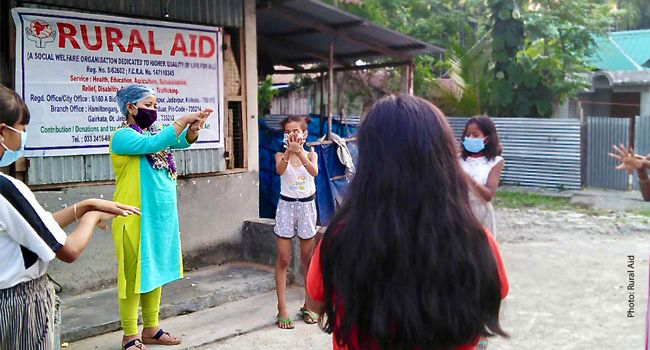 A Rural Aid representative teaches proper handwashing in India